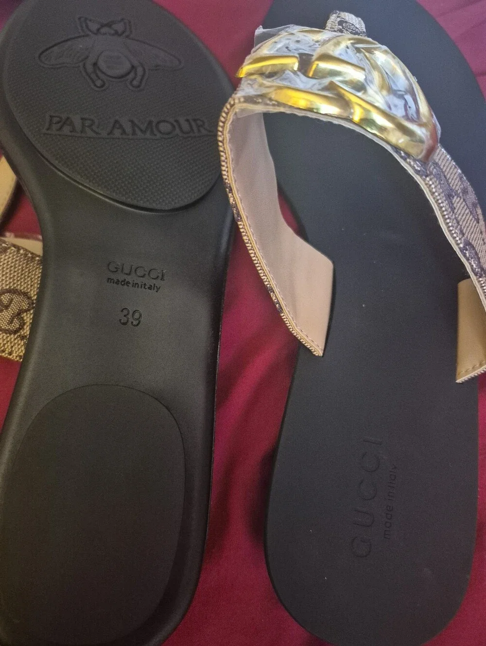 Source Unknown Black Thong Sandals with Gold Emblem and Beige Patterned Straps